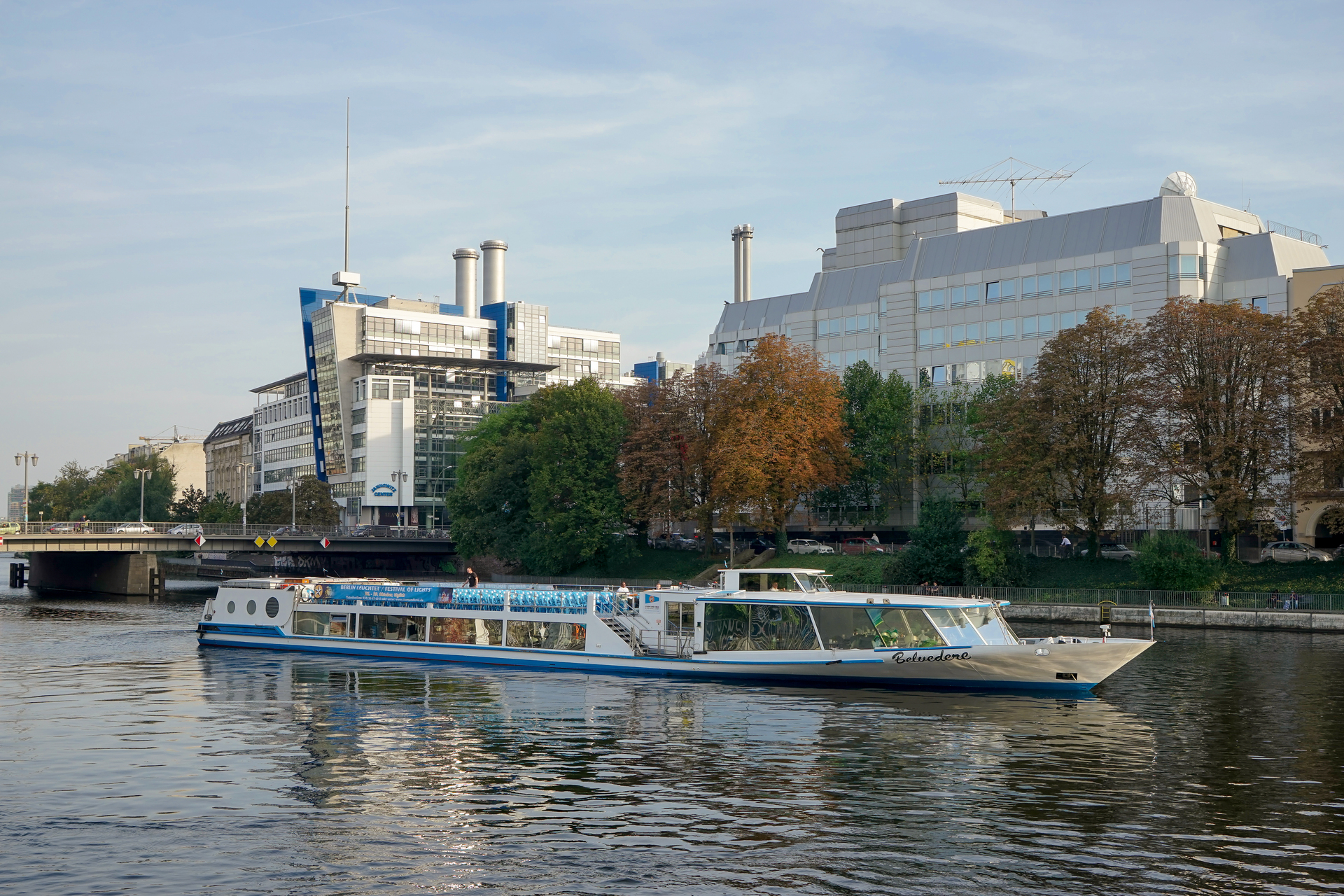 A river cruise boat passing through a European city