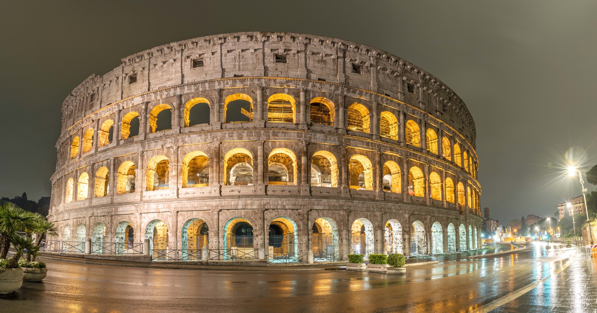 The Colosseum illuminated at night in Rome