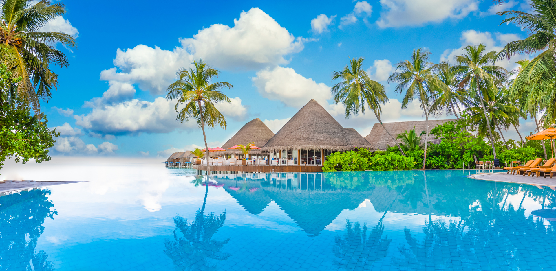 An infinity pool overlooking the sea at a luxury resort