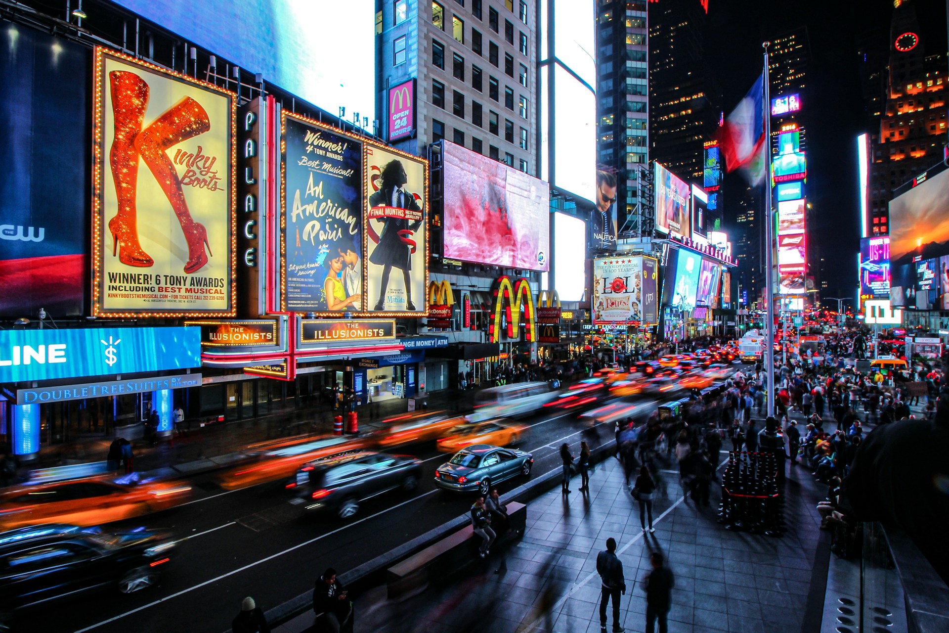 Bright Broadway theatre marquees at night in New York
